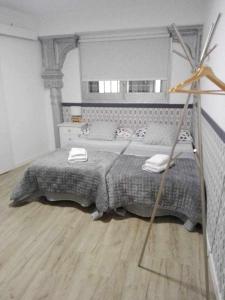 a bedroom with a large bed in a room at Moderno apartamento en el corazón de Madrid Sol in Madrid