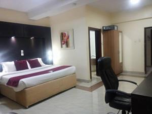 Uma cama ou camas num quarto em Citiheight Hotel