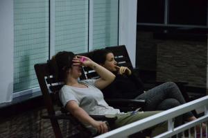 two women sitting in rocking chairs on a porch at Kandyan Feel Free Homestay in Kandy