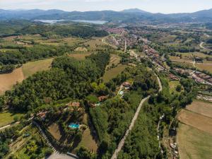 an aerial view of a park with trees and a city at Monteaperto in Barberino di Mugello
