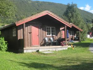 a small house with two horses in it at Smegarden Camping in Oppdal