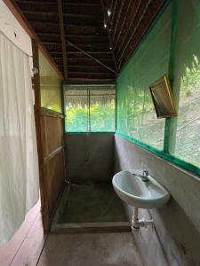 a bathroom with a sink and a shower at Katari Center in Tarapoto