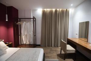 Postel nebo postele na pokoji v ubytování Mergan Hotel