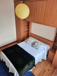 A bed or beds in a room at A CASA DE TOXO