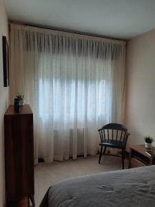 A bed or beds in a room at A CASA DE TOXO