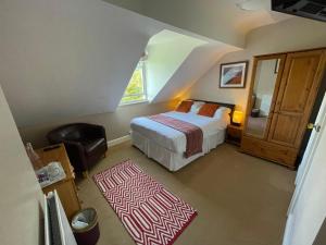 A bed or beds in a room at Ouse Bridge House