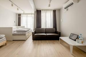 a living room with a couch and a bed at Marvelous Ryogoku - Vacation STAY 74216v in Tokyo