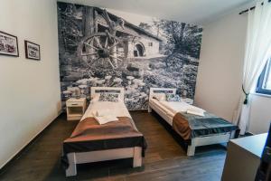 מיטה או מיטות בחדר ב-Bagrina Suites
