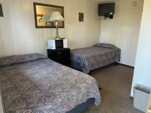 Postel nebo postele na pokoji v ubytování Denali RV Park & Motel