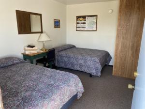 Postel nebo postele na pokoji v ubytování Denali RV Park & Motel