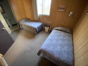 Postel nebo postele na pokoji v ubytování Denali RV Park & Motel