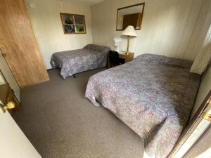 Postel nebo postele na pokoji v ubytování Denali RV Park & Motel