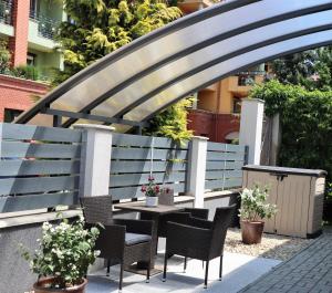 A balcony or terrace at Wolf House Apartman