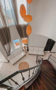 an overhead view of a living room with couches and chairs at Hill House Adult Only in Kaş