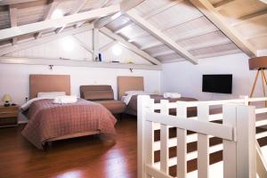A bed or beds in a room at Aria House