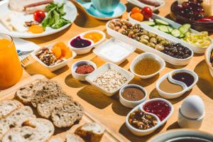 a table with many different types of food on it at Hill House Adult Only in Kaş