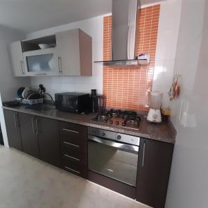 Η κουζίνα ή μικρή κουζίνα στο Apartamento 402-G San Gil