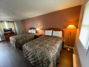 Cama o camas de una habitación en Countryside Motel