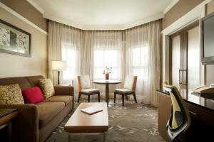 a living room with a couch and a table at Hotel Abri Union Square in San Francisco