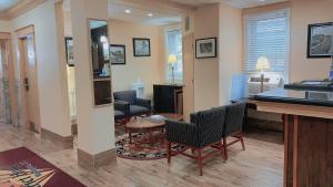 a living room with chairs and a table in a room at District Hotel in Washington