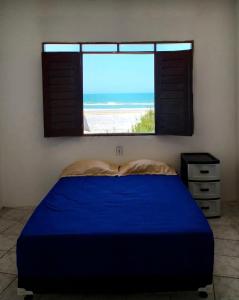 Casa de Praia no Morro Branco tesisinde bir odada yatak veya yataklar