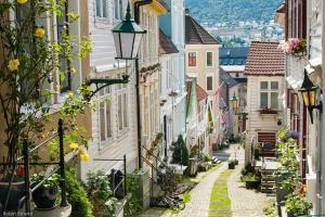 an alley in an old town with buildings at Bergen Beds in Bergen