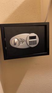 a phone is hanging on a wall at Jamrock Suites in Kingston