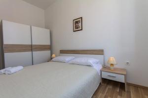 Een bed of bedden in een kamer bij Apartment Cavallo