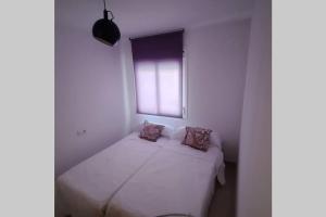 A bed or beds in a room at Agradable casa para disfrutar con los tuyos