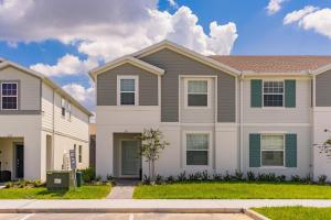 a house in a neighborhood with at Windsor Island Resort 5 Bedroom Townhome Private Pool Disney in Davenport