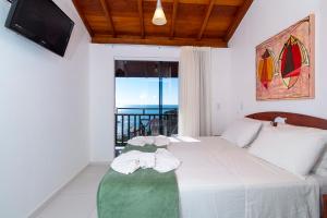 Cama ou camas em um quarto em Pousada Solar das Tartarugas mais 37 fotos