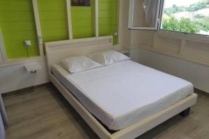 Voodi või voodid majutusasutuse Petit Refuge toas