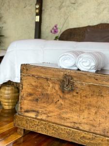 a wooden chest with white plates on top of it at Casa maar -Tented Camp in Río Cuarto