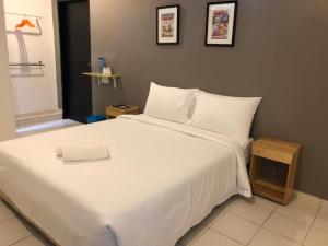 Postel nebo postele na pokoji v ubytování 1108 Hotel Sungkai