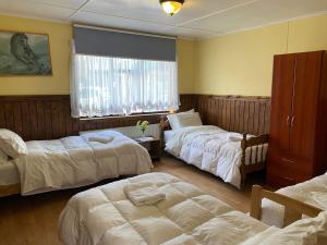 Postel nebo postele na pokoji v ubytování Hostal Hielo Sur