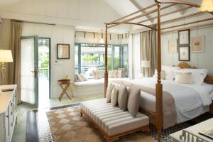 En eller flere senger på et rom på Devasom Hua Hin Resort