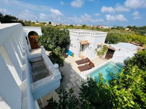 an aerial view of a villa with a swimming pool at Masseria Principe di Puglia in San Vito dei Normanni