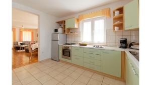 Kuchyň nebo kuchyňský kout v ubytování Holiday Home Tina by Rent Istria