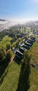 an overhead view of a row of buildings in a field at Moldau Park Nová Pec Lipno in Nová Pec