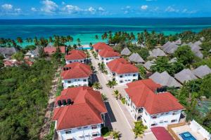 an aerial view of a resort complex with red roofs at Sunny Palms Beach Bungalows in Zanzibar City