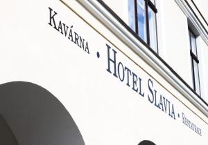 a street sign on the side of a building at Hotel Slavia in Svitavy