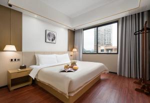 Postel nebo postele na pokoji v ubytování Meeteem Boutique Hotel