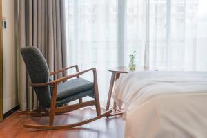 Postel nebo postele na pokoji v ubytování Meeteem Boutique Hotel