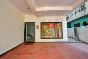 an empty building with a door with a sign on it at FabExpress PAS Residency - Nr Marina Beach in Chennai