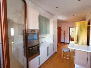 a kitchen with a stainless steel refrigerator and a counter at Casa pergoletto in Venice