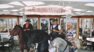 a group of people riding on a carousel at Bujtina e Muriqit in Shkodër