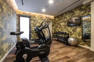 a fitness room with a treadmill and a gym at Sant Jaume Design Hotel in Palma de Mallorca