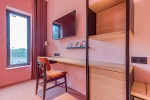 TV a/nebo společenská místnost v ubytování Mah Hotel