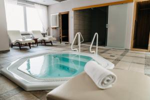 a jacuzzi tub in the middle of a room at Vila Bled in Bled