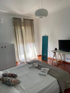 a bedroom with a large bed in a room at La casetta di Ro Ro' Vista sulla Valle dei Templi in Agrigento